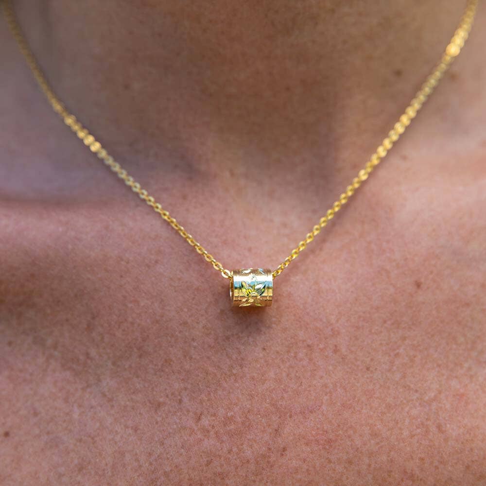 Discover the hidden meaning of barrel pendant featuring this gold barrel engraved pendant