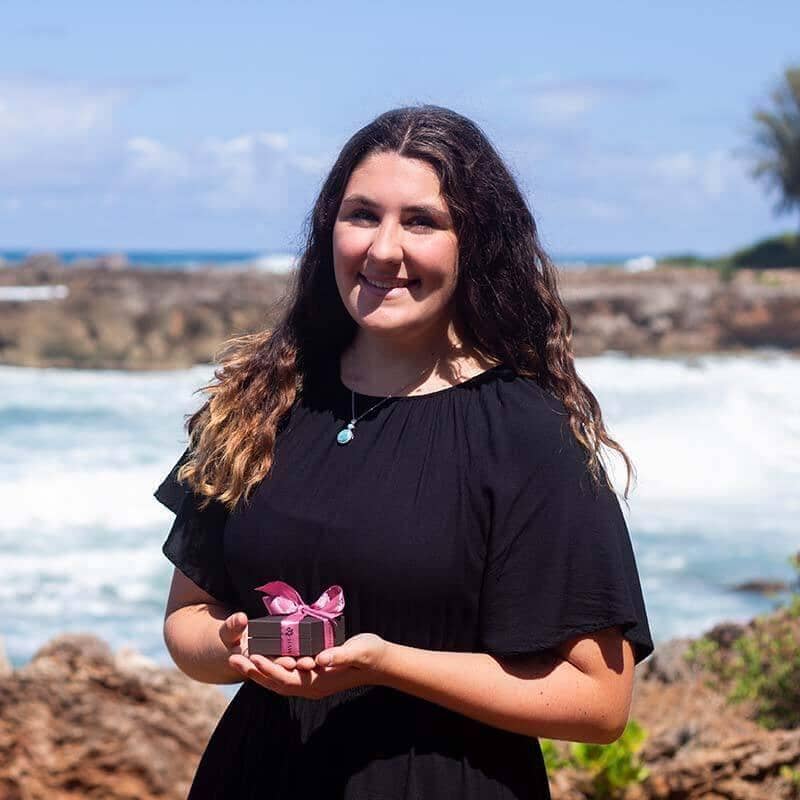 Helen Josephson, a poet in Hawaii wearing a Larimar Jewelry and its box from Island by Koa Nani