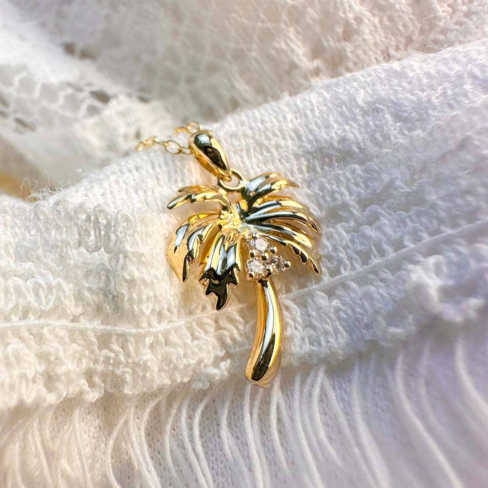 Shine Like the Sun with Our 14k Gold Palm Tree Necklace: A Timeless Symbol of Paradise and Adventure