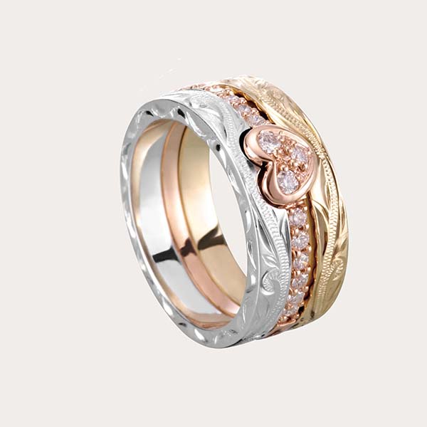 hawaiian heirloom collection featuring 14K tricolor gold ring with heart motif and Hawaiian scroll engraved and lined with diamonds