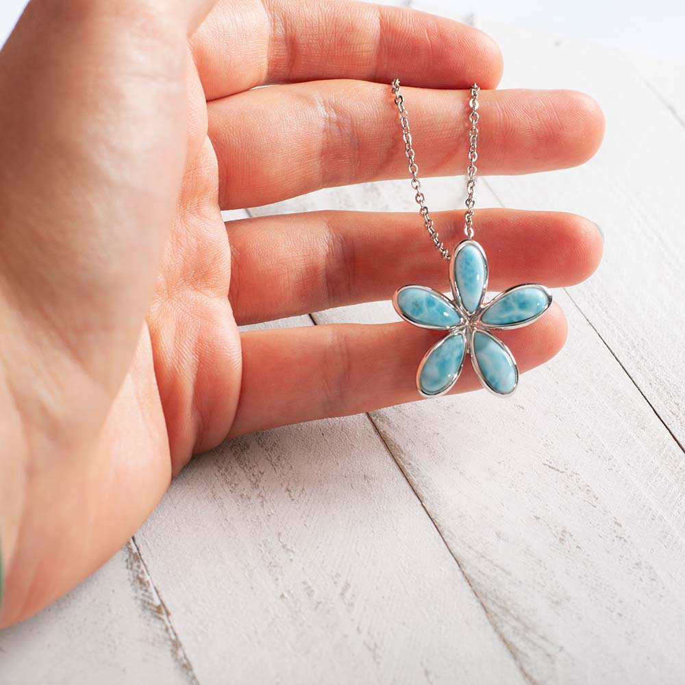 ocean blue larimar plumeria pendant on a chain