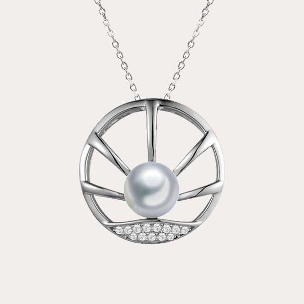 celestial pearl collection featuring a sun rise motif pendant with white pearl and white topaz set in 925 sterling silver