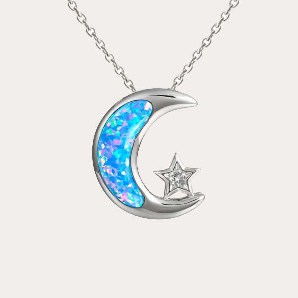 celestial pendant collection featuring the sustainable blue opal moon and white topaz star pendant
