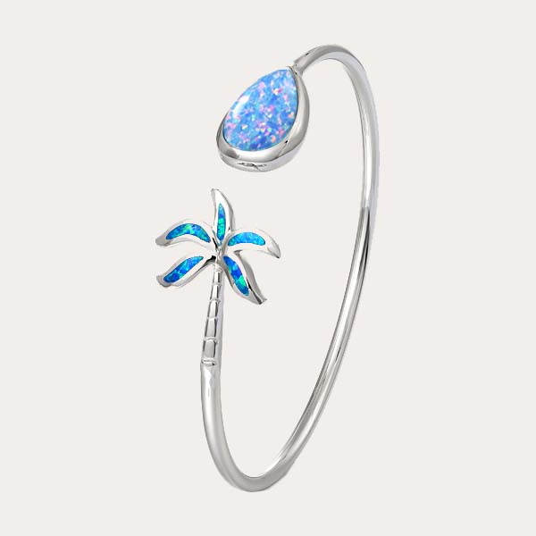 classic opal collection features a silver open flexi bangle with sustainable opal palm tree on one end and a teardrop shape on the other
