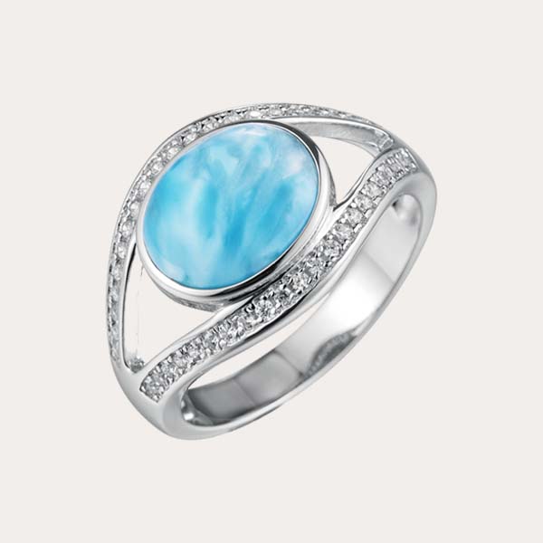 classic ring collections features an ocean blue larimar lined with white topaz