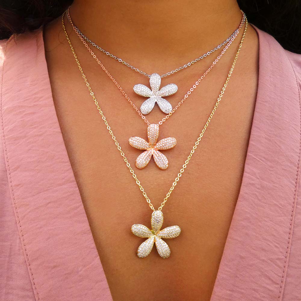14K gold pavé plumeria pendants featuring three different gold tones of white gold, rose gold and yellow gold