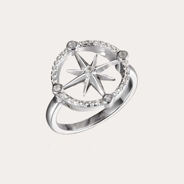 island lifestyle ring collection featuring the compass ring lined with white topaz