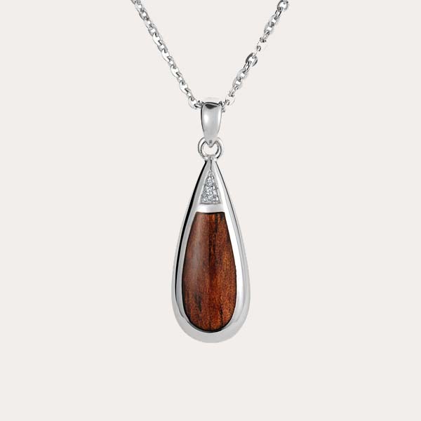 koa wood classic collection featuring a teardrop shaped pendant with diamonds