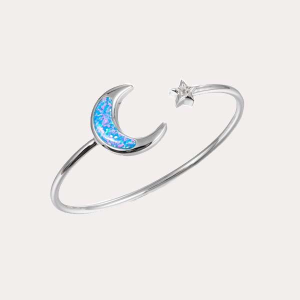 sustainable opal celestial collection featuring the moon and star flexi bangle design