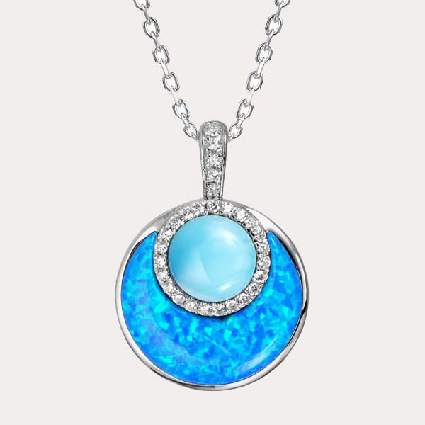 sustainable opal and ocean blue larimar collection featuring a circle pendant with white topaz