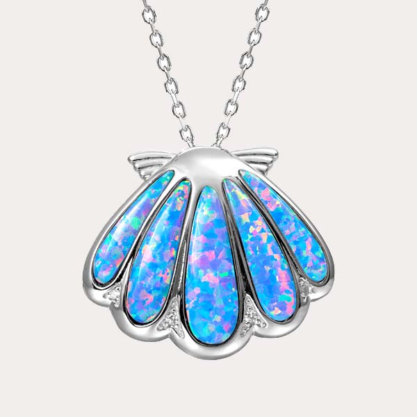 sustainable blue opal pendant collection featuring a shell pendant with white topaz
