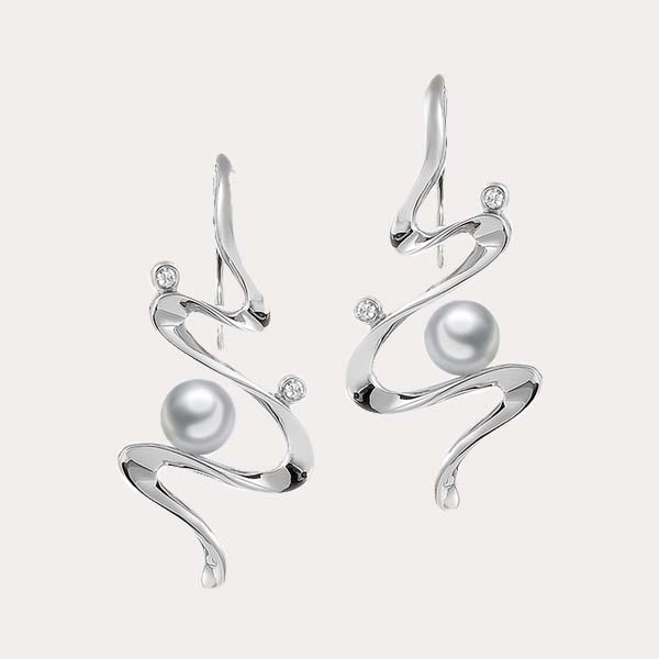 pearl earrings collection featuring the abstract wave design of the universe stud earrings with white pearl and white topaz 