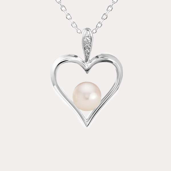 Akoya pearl pendant featuring a silver heart pendant with a pinkish akoya pearl