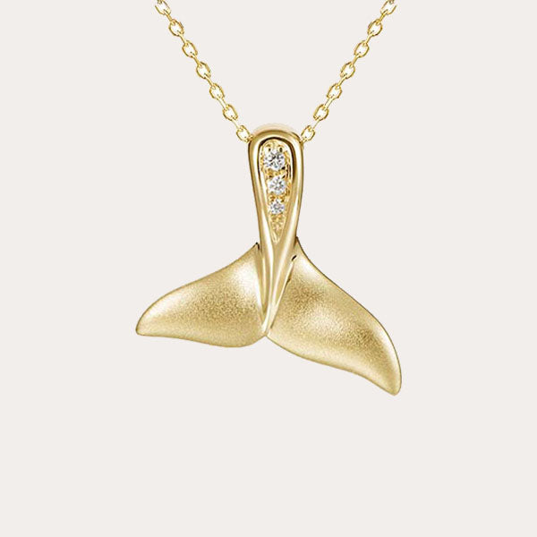 sea life 14k gold collection features a whale tail pendant set in 14K solid yellow gold and diamonds