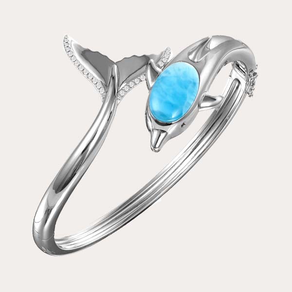 sea life larimar collection features a silver dolphin open hinged bangle with ocean blue Larimar and white topaz along its tail