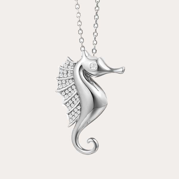 sea life pendant collection features a silver sea horse pendant with white topaz on its eyes and back