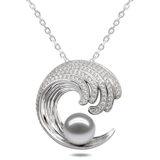 In this photo there is a white gold wave pendant with diamonds and one white pearl.