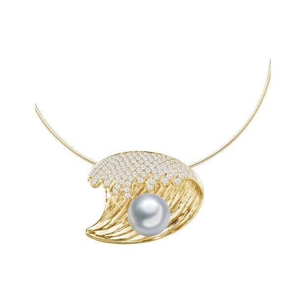 In this photo there is a yellow gold wave pendant with diamonds and one white pearl.