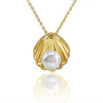 In this photo there is a yellow gold oyster shell pendant with one white akoya pearl.