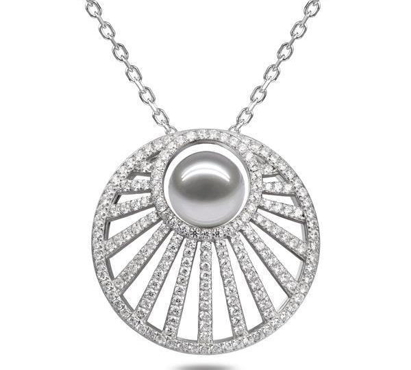 In this photo there is a white gold sun rays pendant with one white pearl and lined with diamonds.