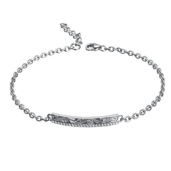 The picture shows a 14K white gold bar bracelet with diamonds and whale engraving.