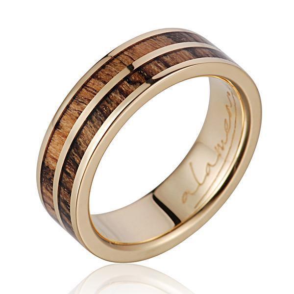 In this photo there is a 14K yellow gold and bocote wood ring.