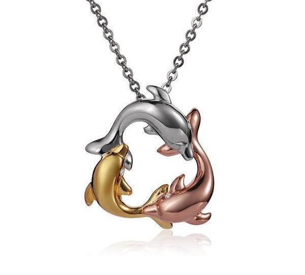 The picture shows a 14K yellow, white, and rose gold three dolphin pendant.