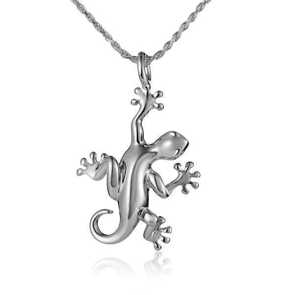 In this photo there is a white gold gecko pendant.