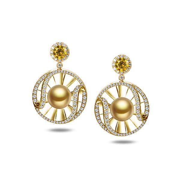 In this photo there is a pair of 14k yellow gold sun and wave dangle earrings with golden pearls, diamonds, and citrine.