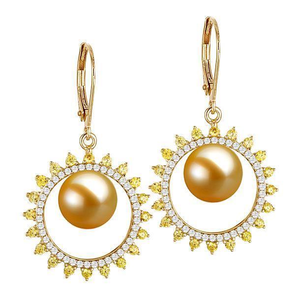 In this photo there is a pair of 14k yellow gold sun lever-back earrings, with yellow and white diamonds and golden south sea pearls.