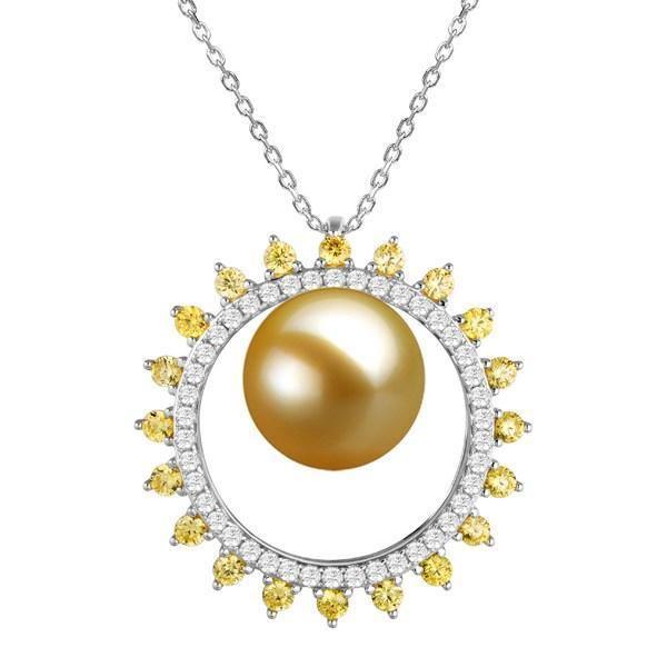 In this photo there is a white gold sun pendant with white and yellow diamonds and one golden south sea pearl.