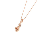 The picture shows a 14K rose gold heart Lock charm with hand-engraved detailing.