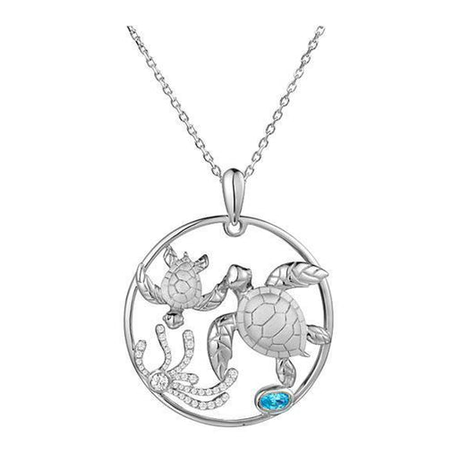 The picture shows a 14K white circle pendant featuring two sea turtles, sea weed of diamonds and  aquamarine.