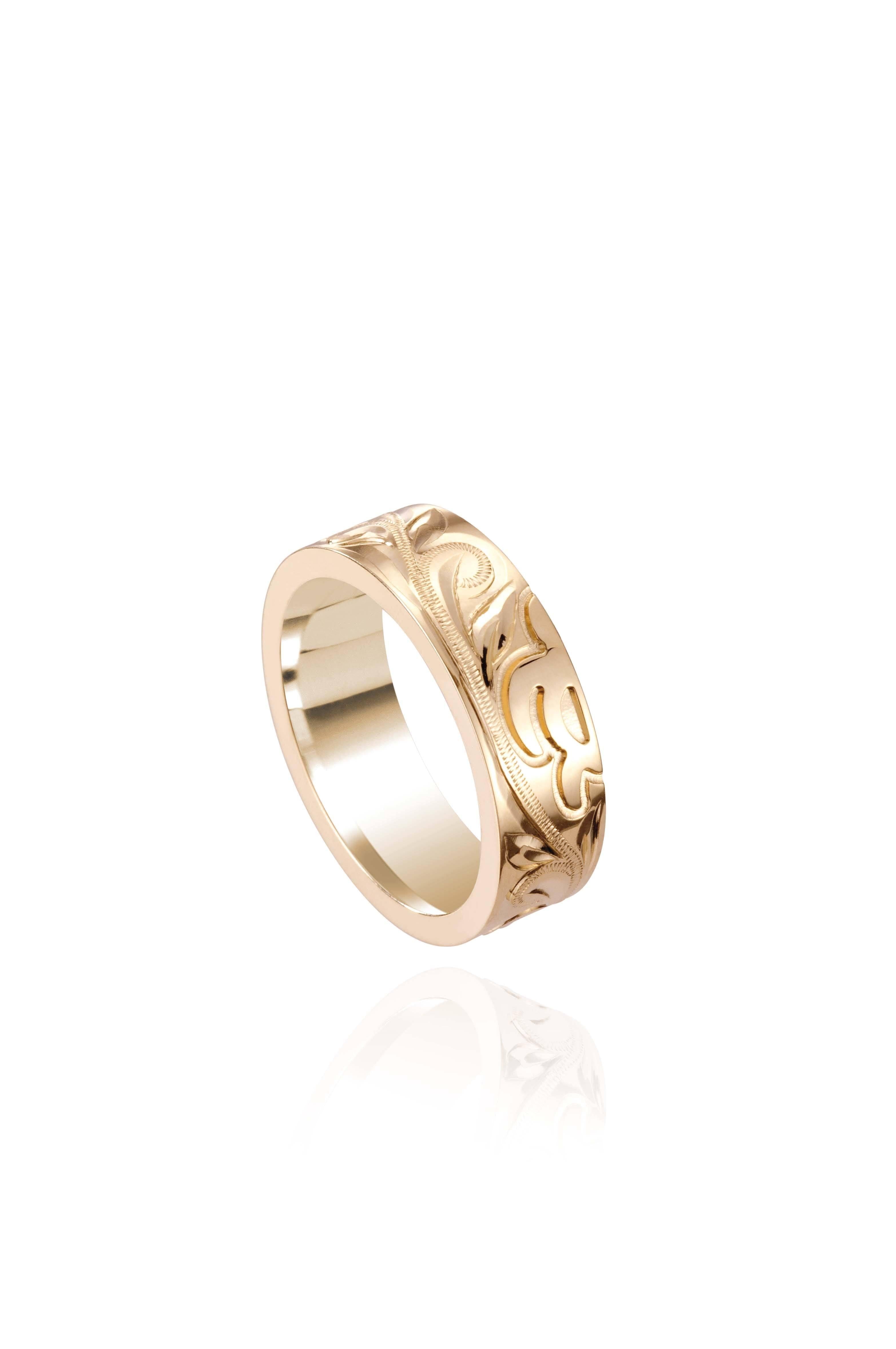 The picture shows a 14K yellow gold sea turtle naupaka 6 mm ring.