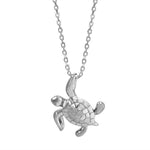 The picture shows a 14K white gold sea turtle necklace.