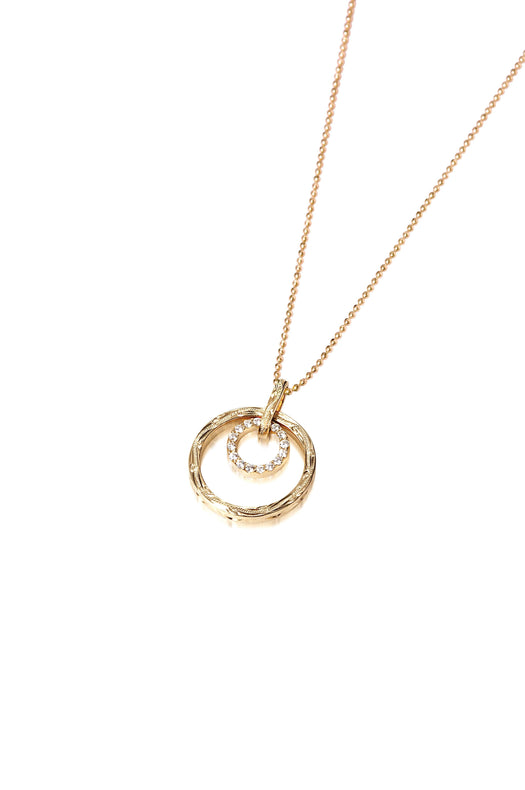 The picture shows a 14K yellow gold two circle infinity scroll pendant with hand engravings and diamonds.