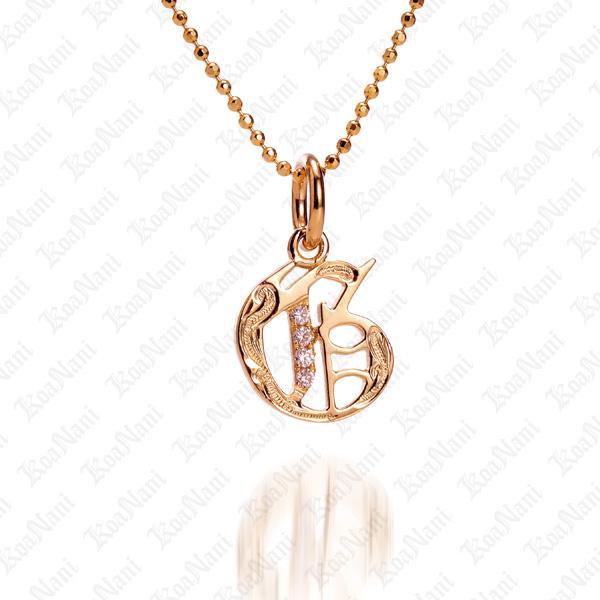 The picture shows a 14K yellow gold Koa Nani G initial pendant.