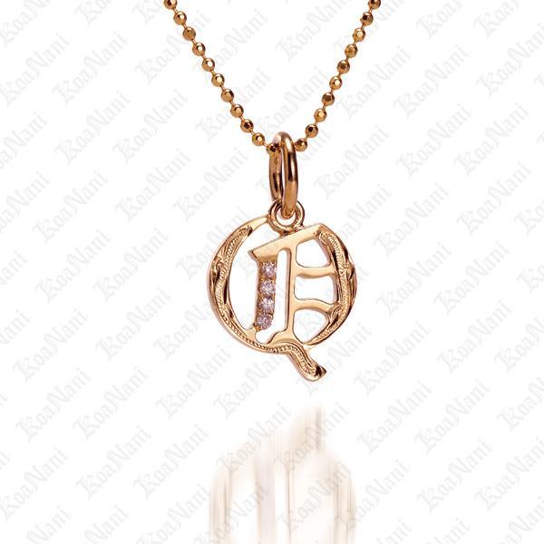 The picture shows a 14K yellow gold Koa Nani Q initial pendant.