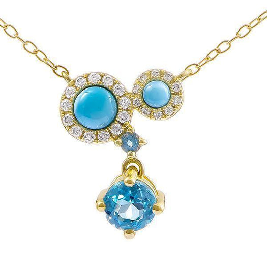 The photo shows a 14K yellow gold constellation pendant with two larimar gems, two aquamarine gems, and diamonds.