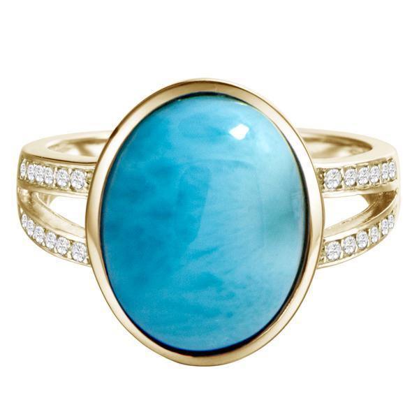 The picture shows a 14K yellow gold larimar cocktail ring with a split band lined with diamonds and topaz gemstones