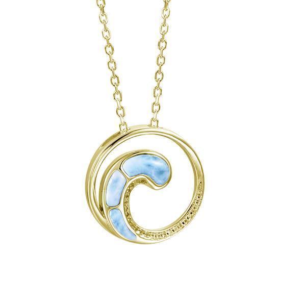 In this photo there is a yellow gold circle pendant with a wave and blue larimar gemstones.