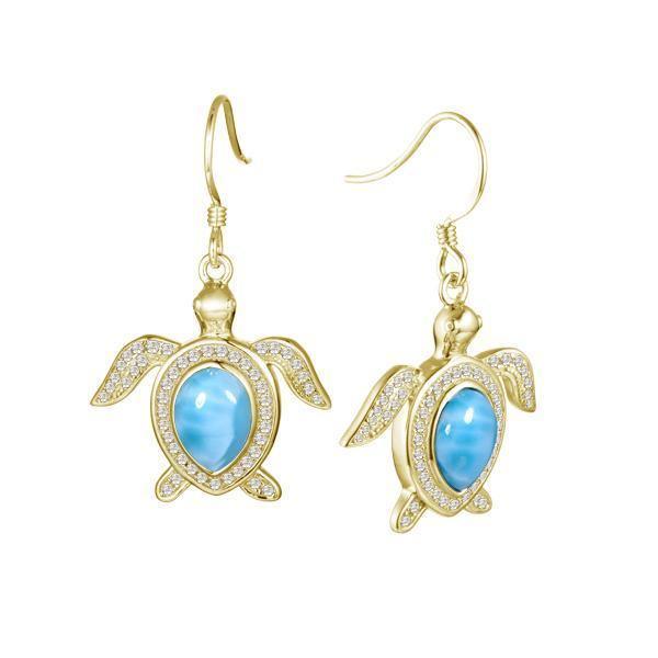 The picture shows a pair of 14K yellow gold sea turtle hook earrings with larimar gemstones and pavé diamonds.