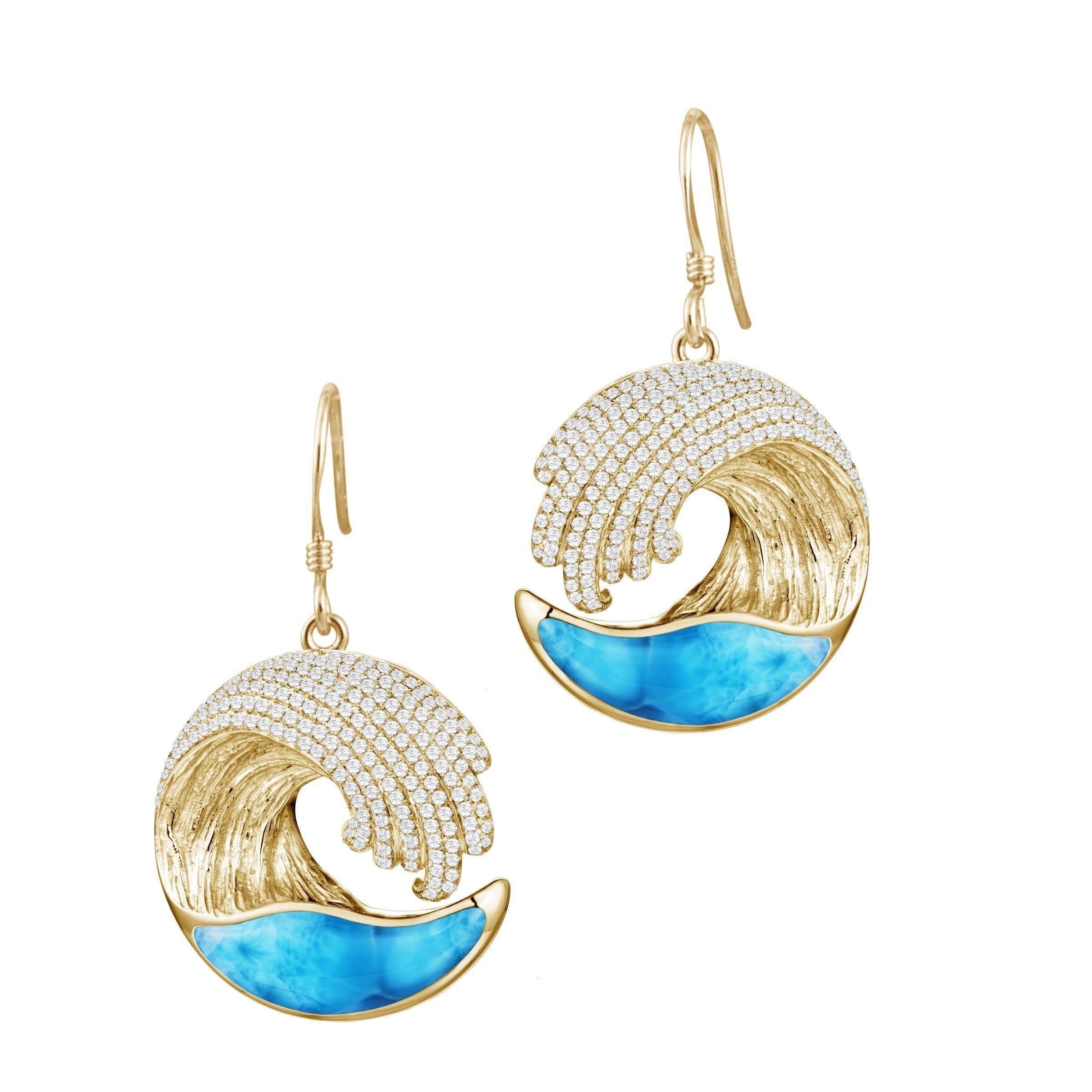 This picture shows 14k yellow gold larimar ocean wave earrings with diamonds.