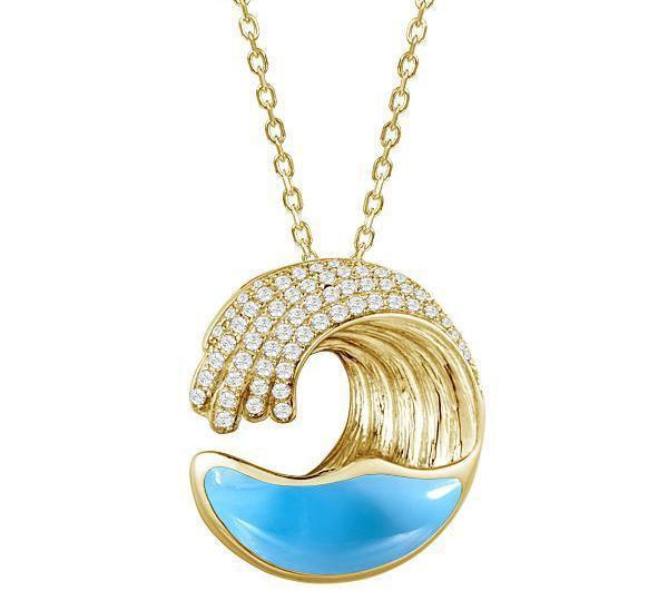 The photo shows a small 14k yellow gold larimar ocean wave pendant with diamonds.