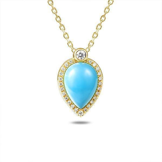 In this photo there is a yellow gold petal pendant with a center diamond and blue larimar gemstone surrounded by smaller diamonds.