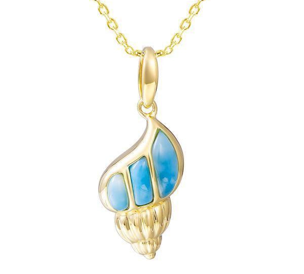 In this photo there is a yellow gold seashell pendant with blue larimar gemstones.