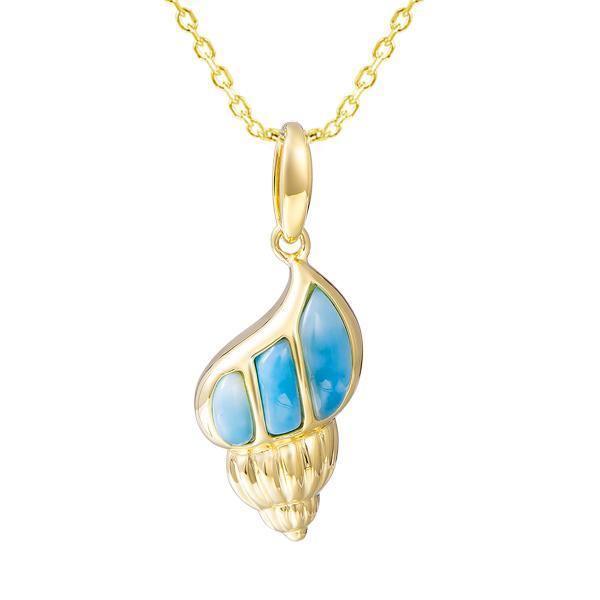 In this photo there is a yellow gold seashell pendant with blue larimar gemstones.