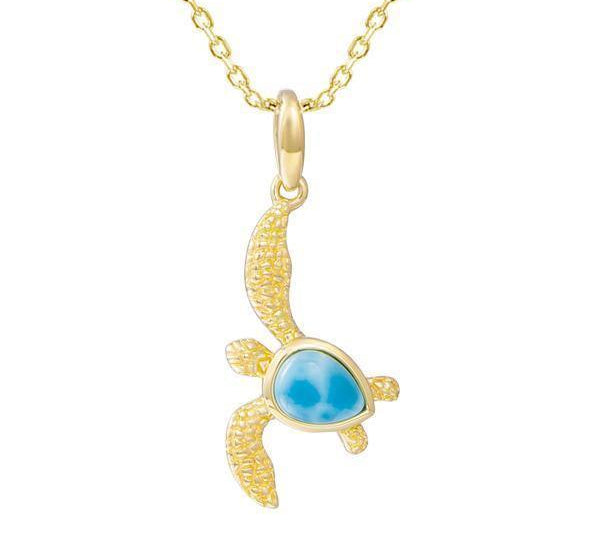 The picture shows a 14K yellow gold sea turtle pendant with a larimar gemstone.