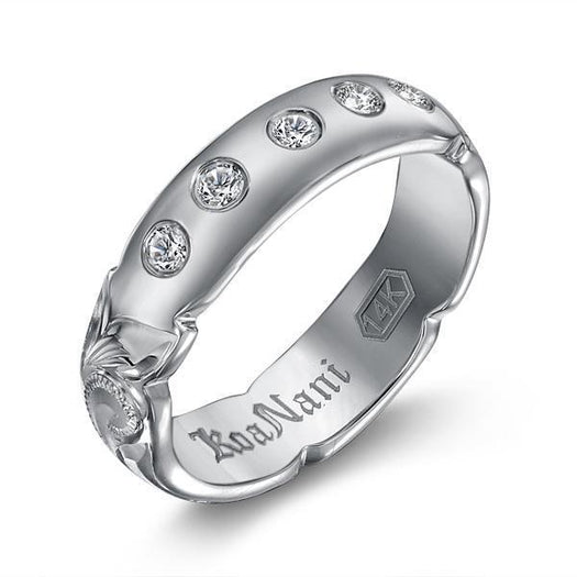 The picture shows a 14K white gold 5 mm ring with hand engravings and diamonds.