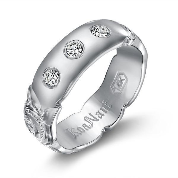 The picture shows a 14K white gold 6mm ring with hand engravings and diamonds.